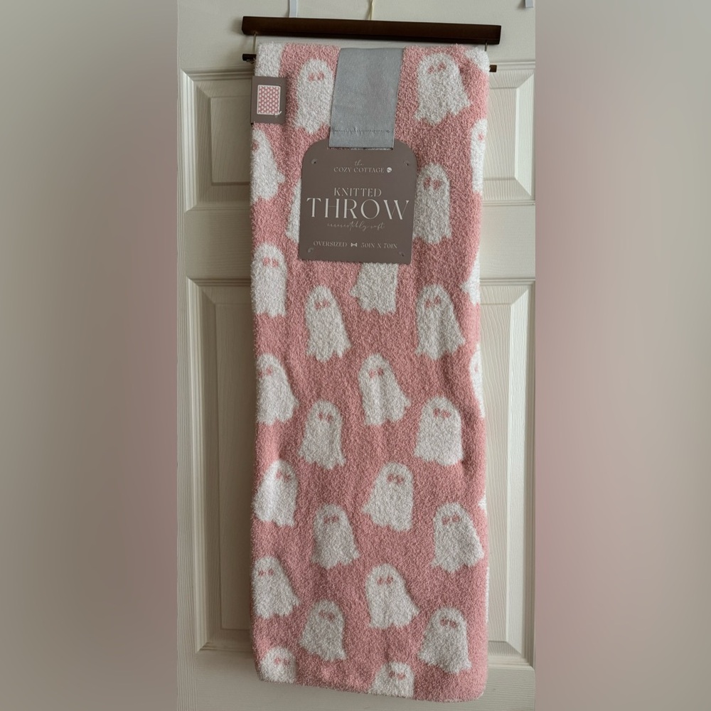 Brand new light pink and white ghost Halloween blanket.